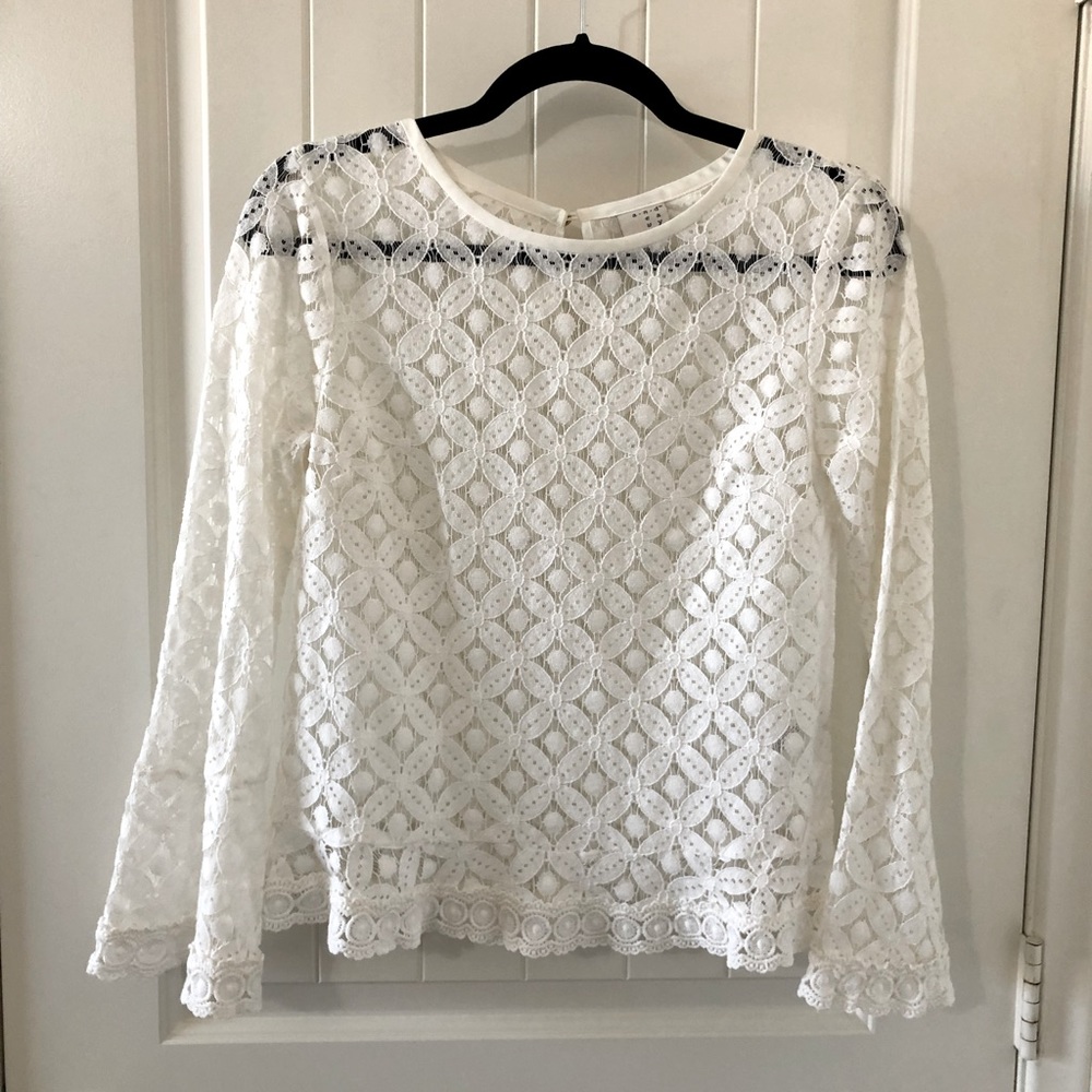 Lace blouse with bell sleeves.